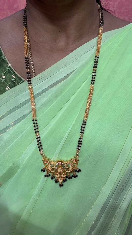 Traditional gold mangalsutra featuring a delicate floral lakshmi motif