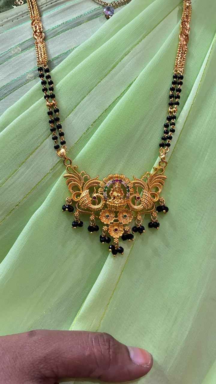 Traditional gold mangalsutra featuring a delicate floral lakshmi motif