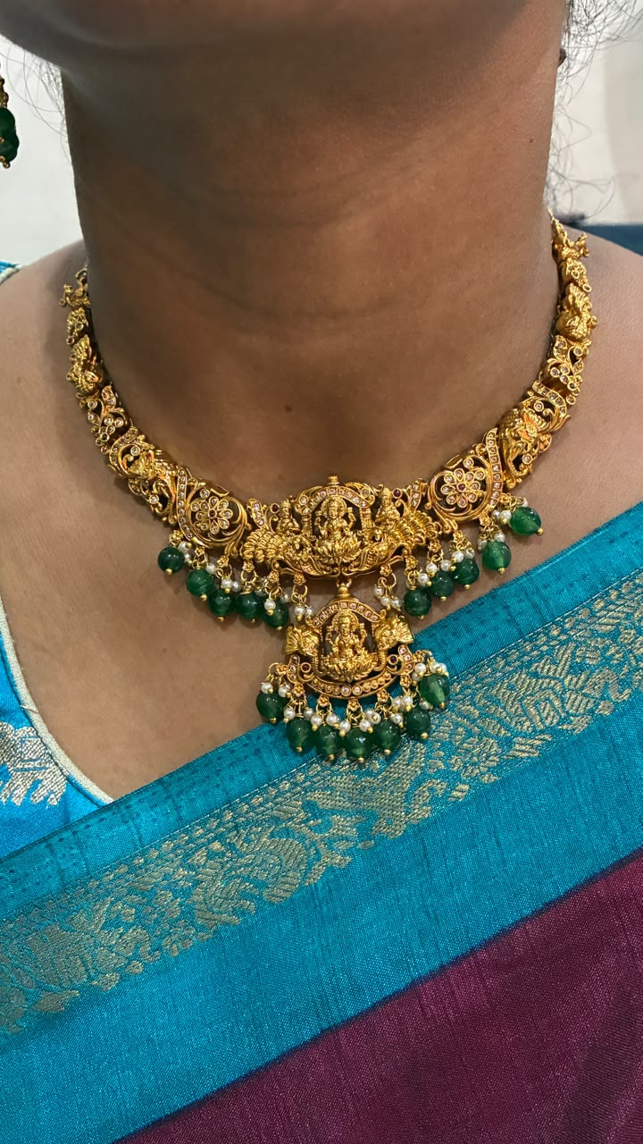 Temple jewelry necklace Lakshmi and peacock design adorned with green bead drops