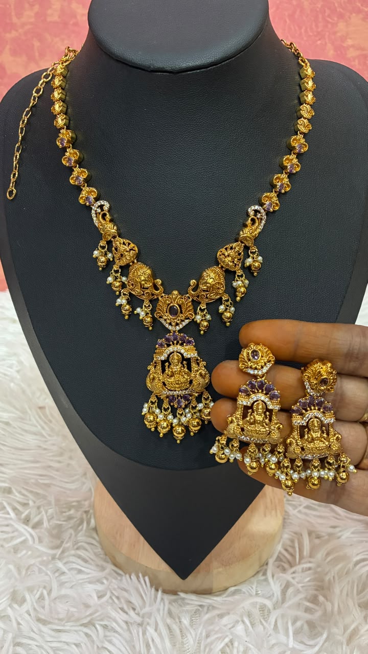 Antique gold-plated temple jewelry set features intricate Lakshmi motifs
