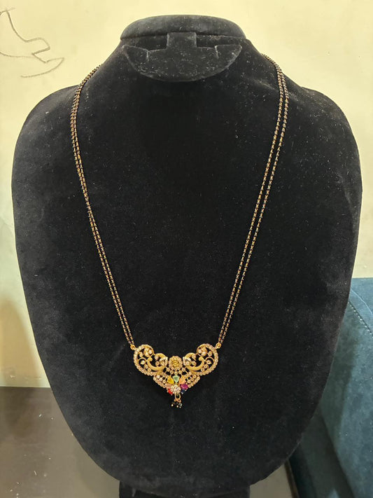 Mangalsutra peacock motifs and a center with colorful Navratan stones