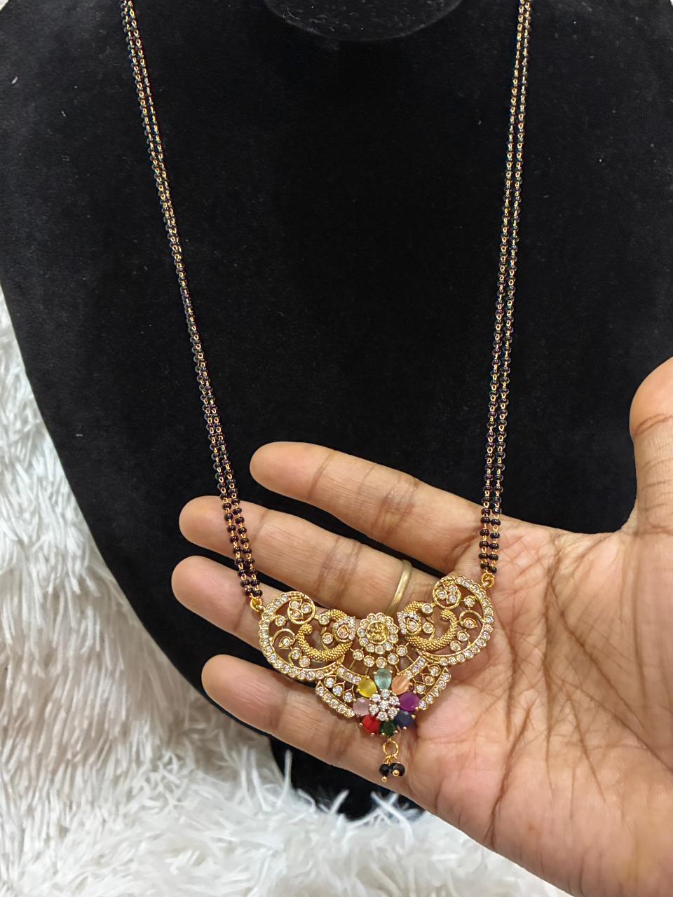 Mangalsutra peacock motifs and a center with colorful Navratan stones