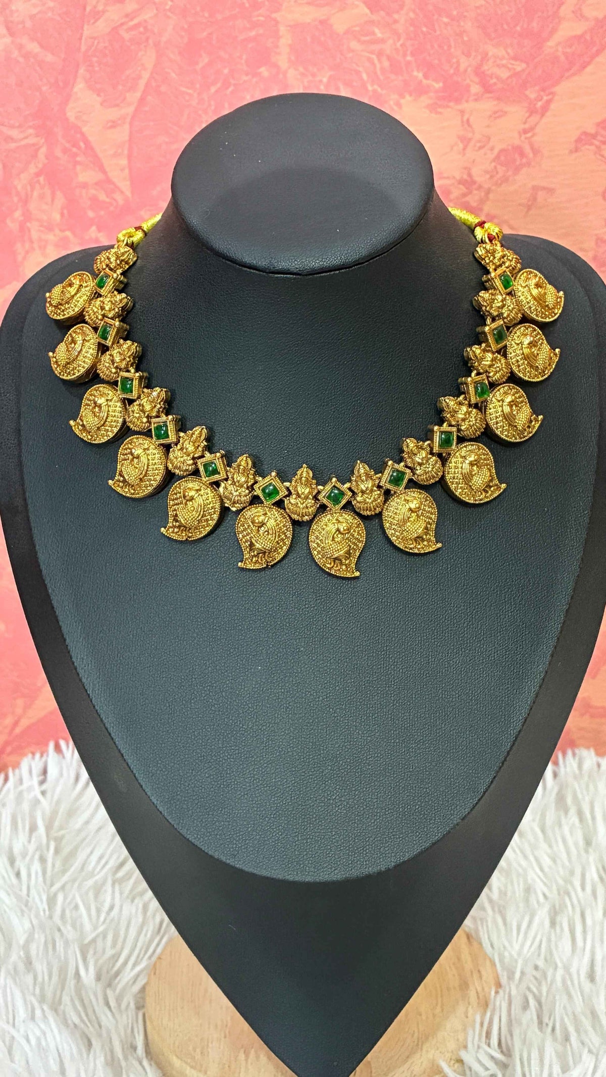 Antique-finish mango necklace featuring intricate paisley motifs