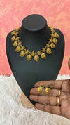 Antique-finish mango necklace featuring intricate paisley motifs