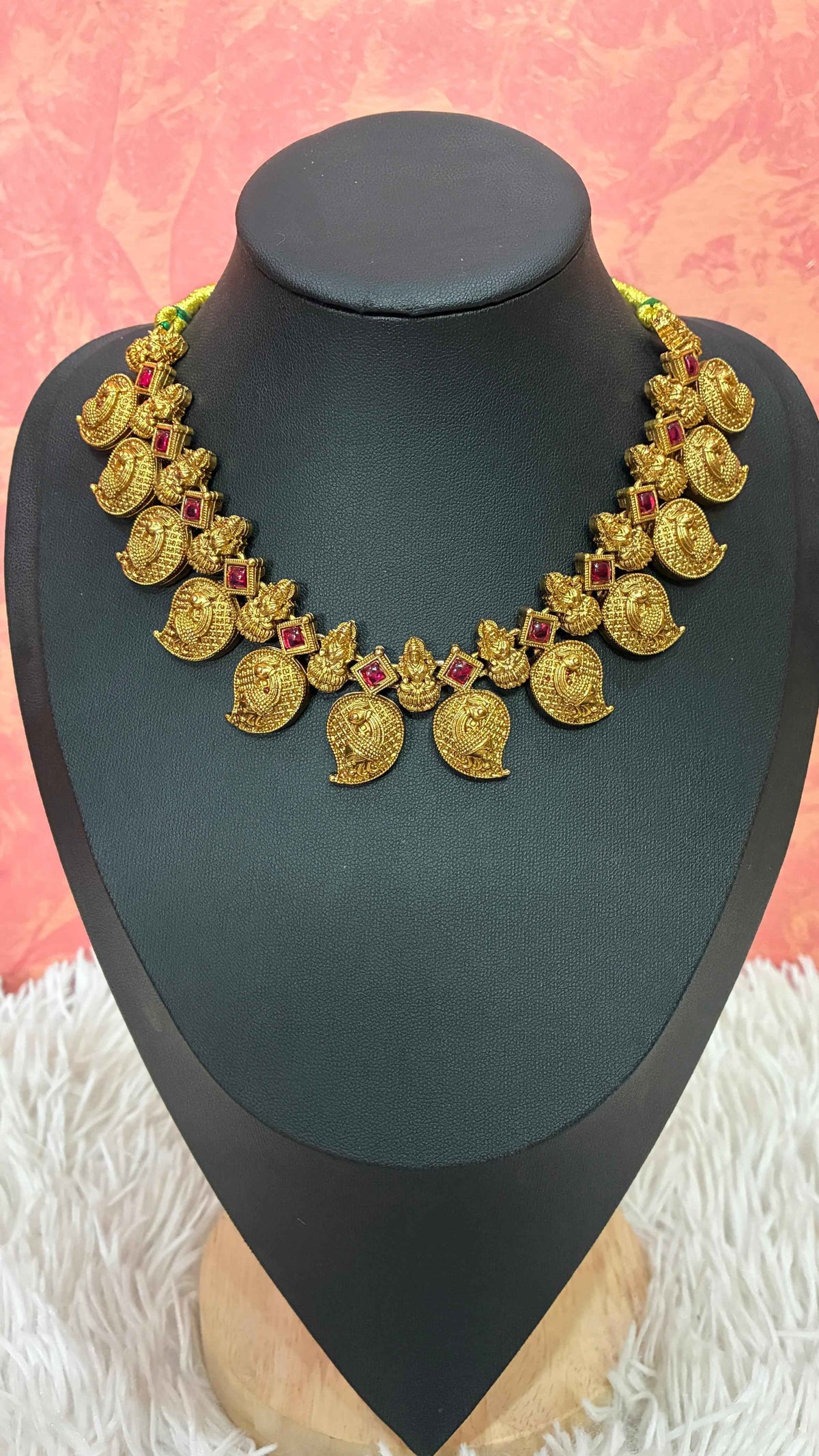 Antique-finish mango necklace featuring intricate paisley motifs