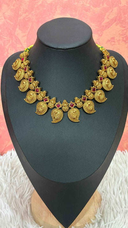 Antique-finish mango necklace featuring intricate paisley motifs
