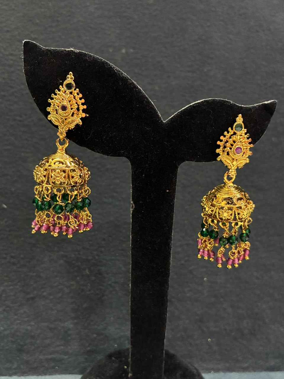 Gold-plated temple jhumka with ruby stones, and green beads