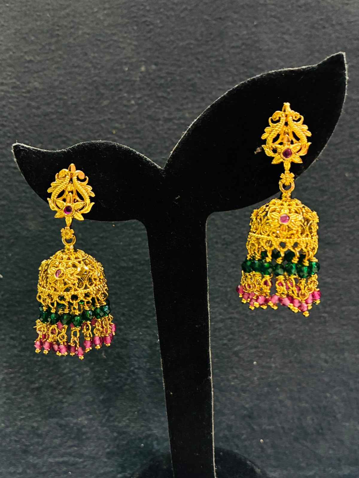 Gold-plated Jhumka earrings with multicolored green and pink beaded hangings