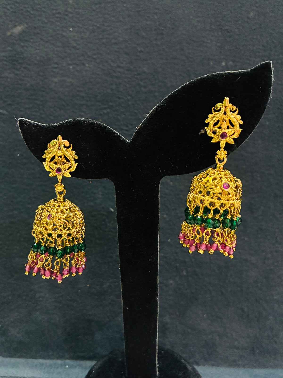 Gold-plated Jhumka earrings with multicolored green and pink beaded hangings
