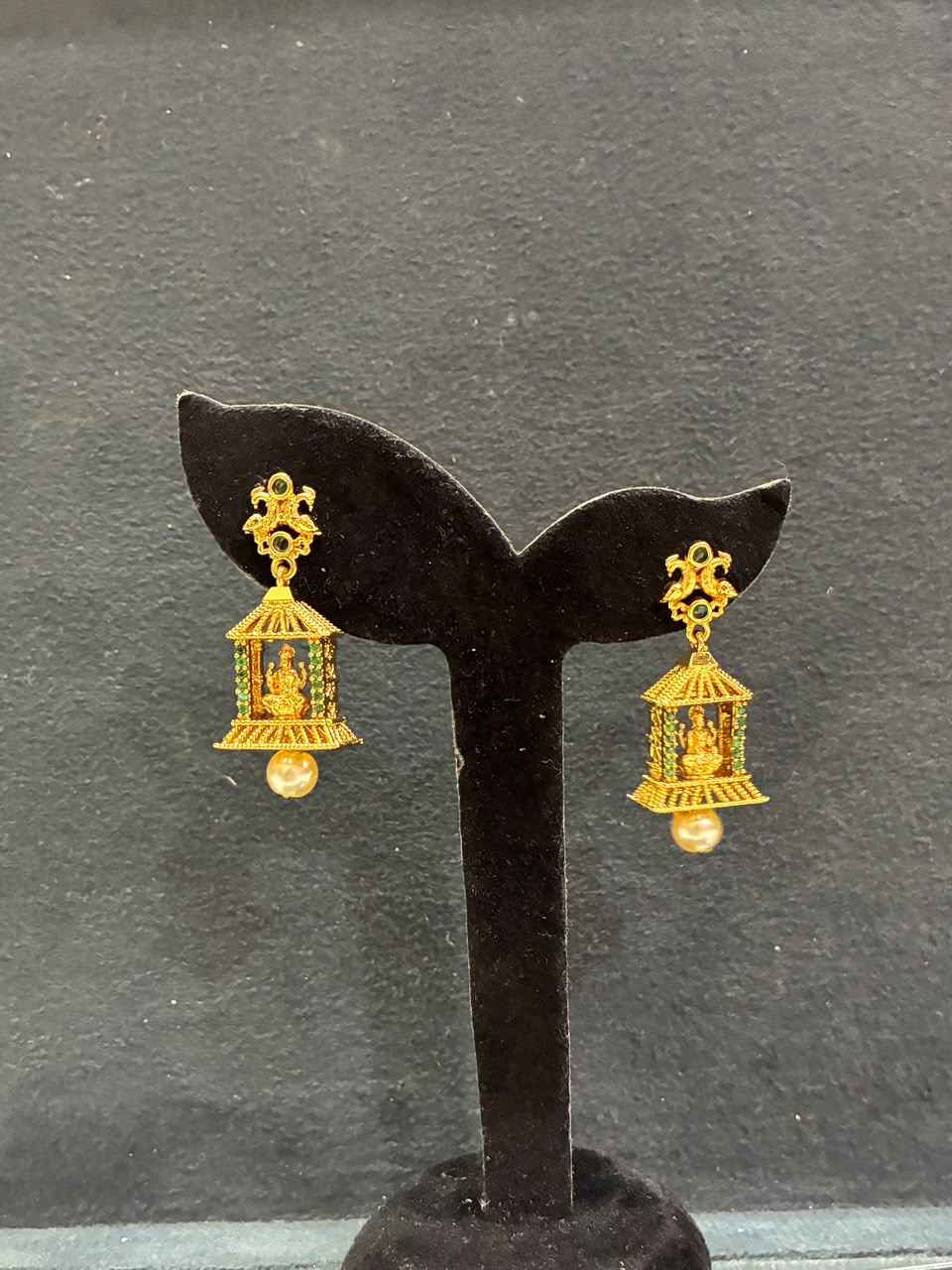 Jhumka earrings gold-plated Lakshmi motif within a peacock-accented cage design