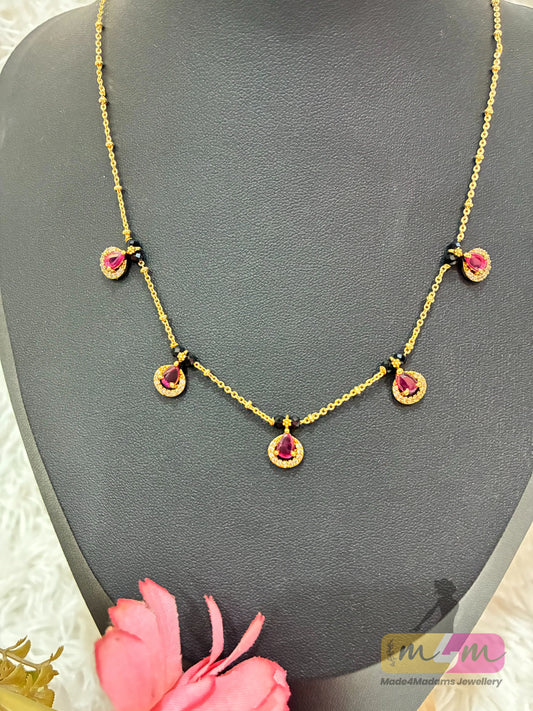 Gold-Plated Black Beaded Mangalsutra with pink Drop Pendants Made4Madams
