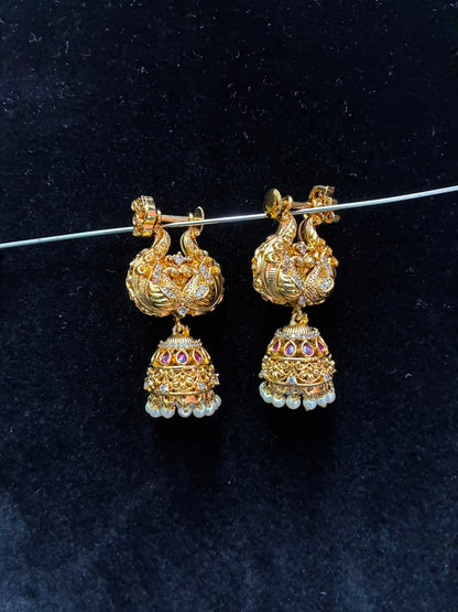 Makarakundanalu feature a detailed peacock design adorned with white stones
