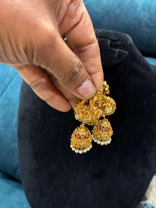 Makarakundanalu feature a detailed peacock design adorned with white stones