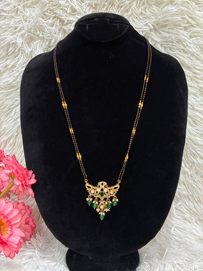 Mangalsutra necklace features a dual-peacock design pendant