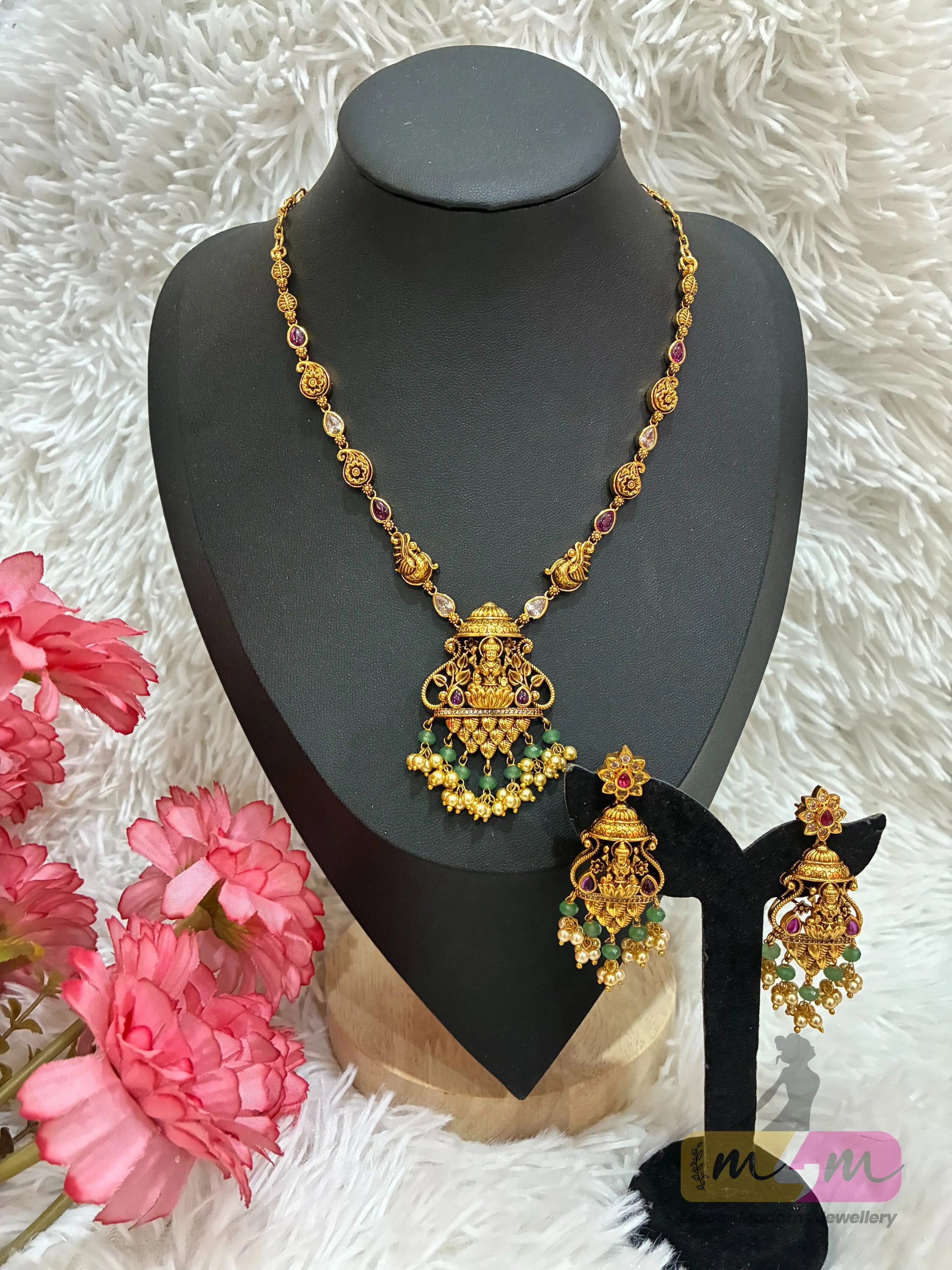 Gold-plated necklace and Earring set featuring Lakshmi, peacock motifs. Made4Madams