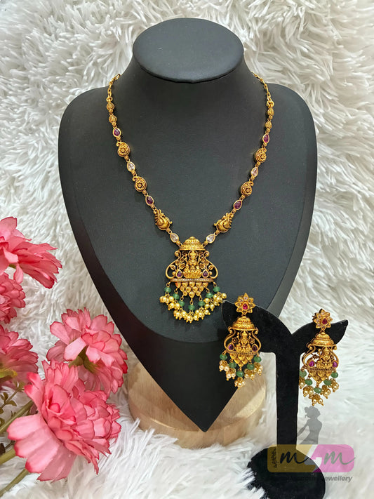 Gold-plated necklace and Earring set featuring Lakshmi, peacock motifs. Made4Madams
