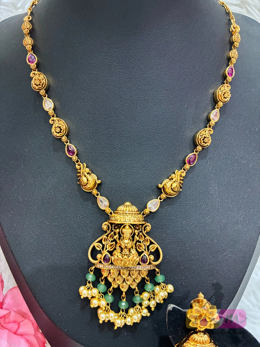 Gold-plated necklace and Earring set featuring Lakshmi, peacock motifs. Made4Madams