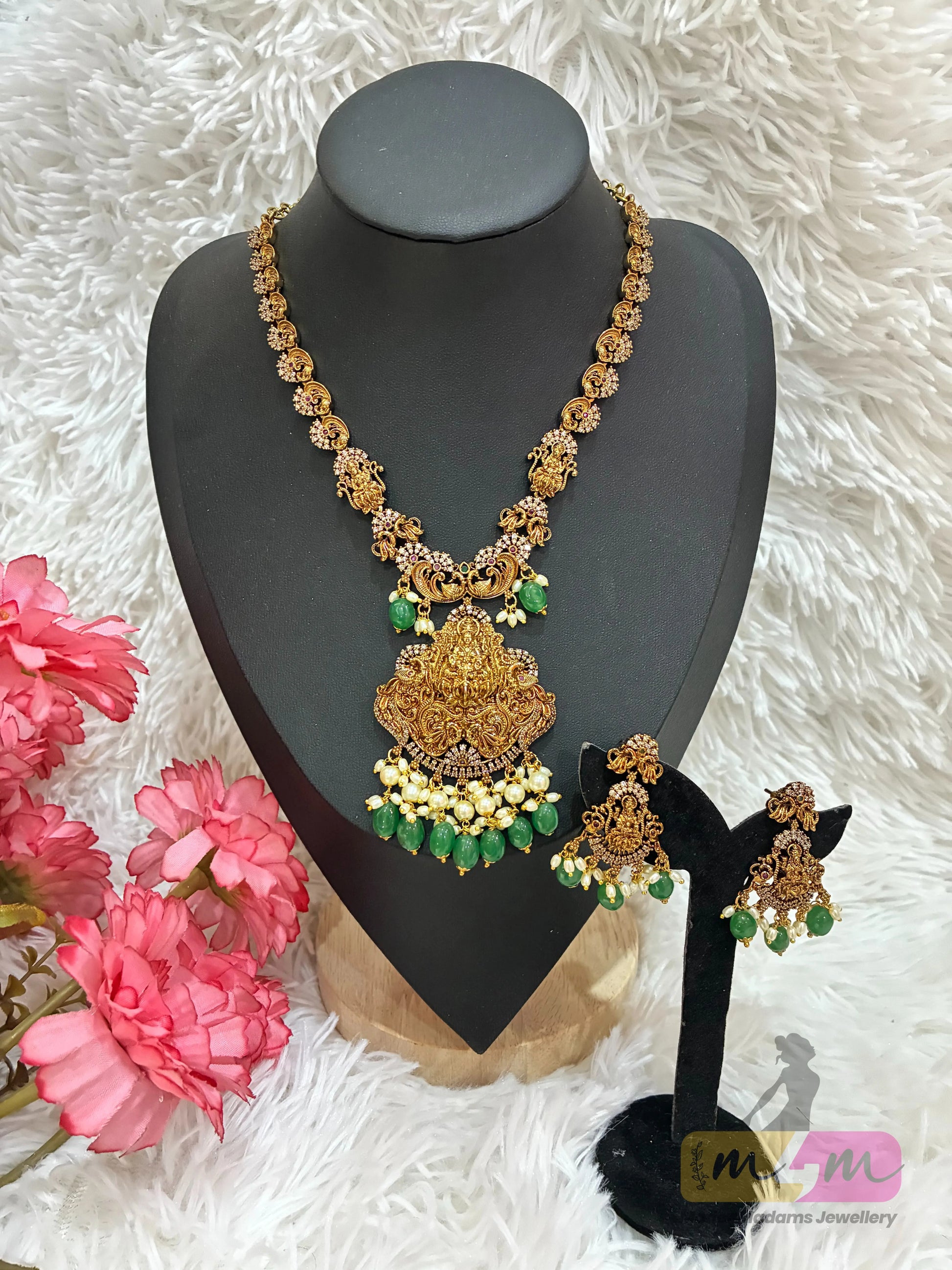 Gold-plated temple style necklace with a Goddess Lakshmi pendant and matching  earrings with green beads Made4Madams