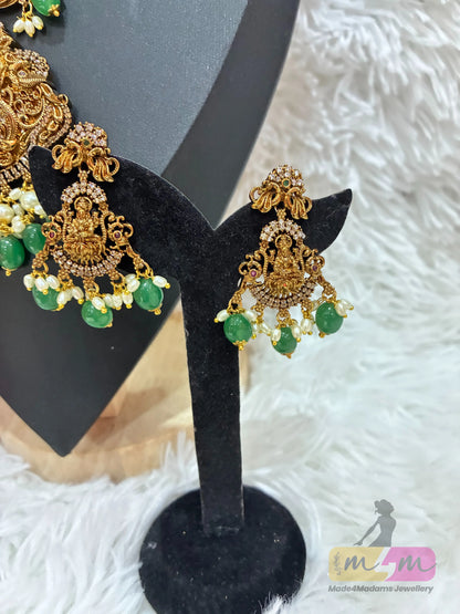 Gold-plated temple style necklace with a Goddess Lakshmi pendant and matching  earrings with green beads Made4Madams