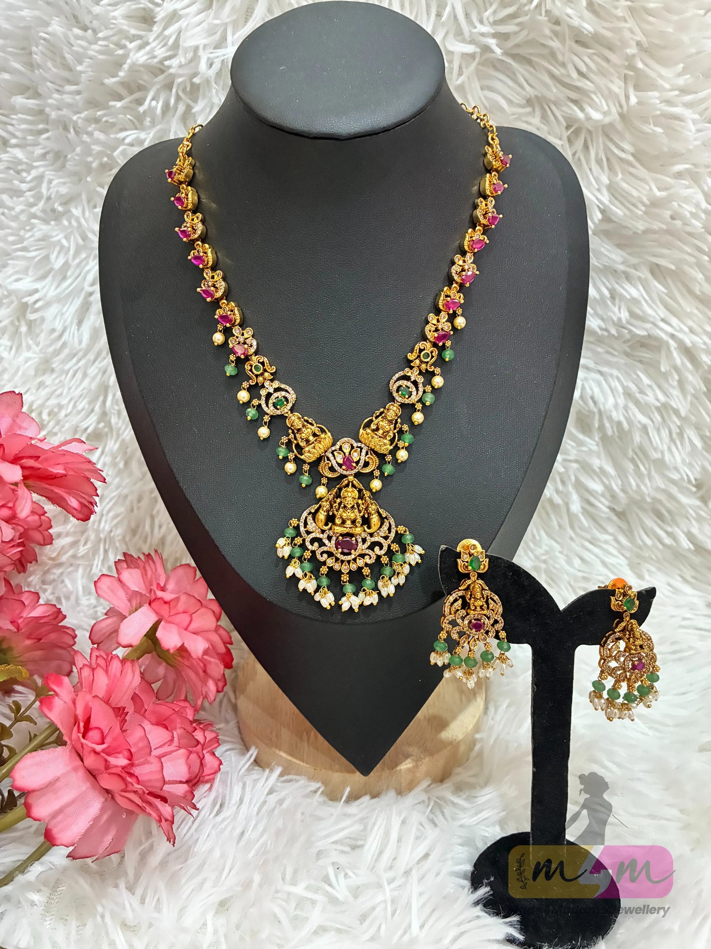 Gold-plated temple Design necklace and earrings set featuring a Lakshmi pendant and CZ stones in multi-color. Made4Madams