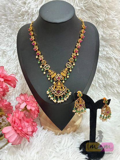 Gold-plated temple Design necklace and earrings set featuring a Lakshmi pendant and CZ stones in multi-color. Made4Madams