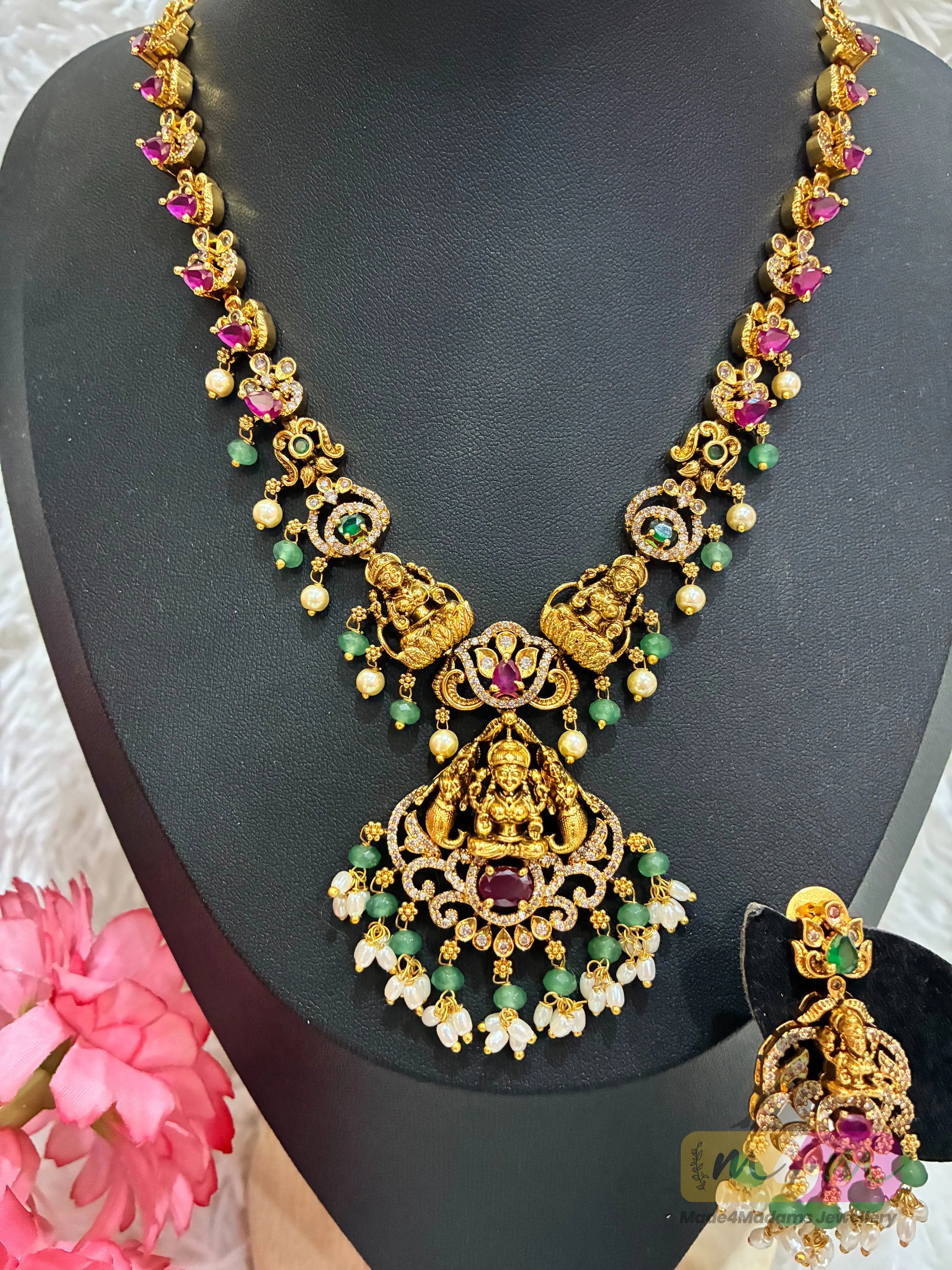 Gold-plated temple Design necklace and earrings set featuring a Lakshmi pendant and CZ stones in multi-color. Made4Madams