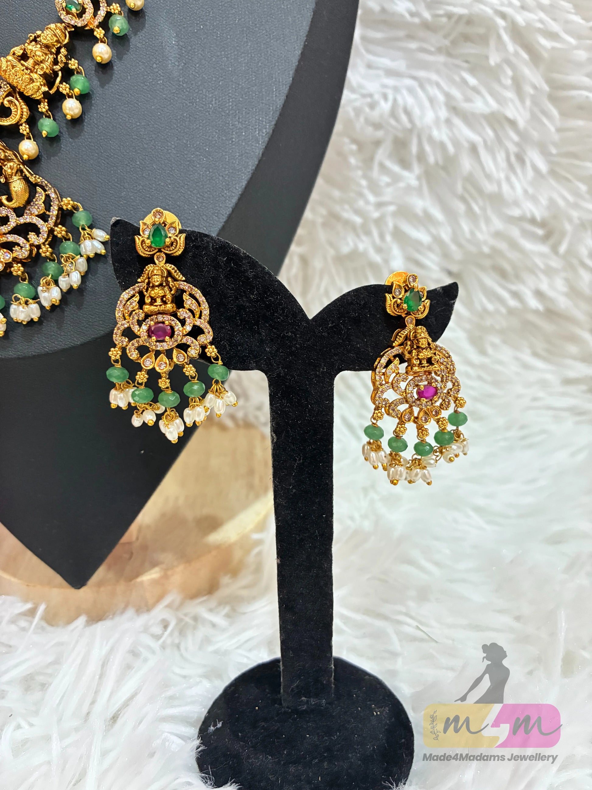 Gold-plated temple Design necklace and earrings set featuring a Lakshmi pendant and CZ stones in multi-color. Made4Madams