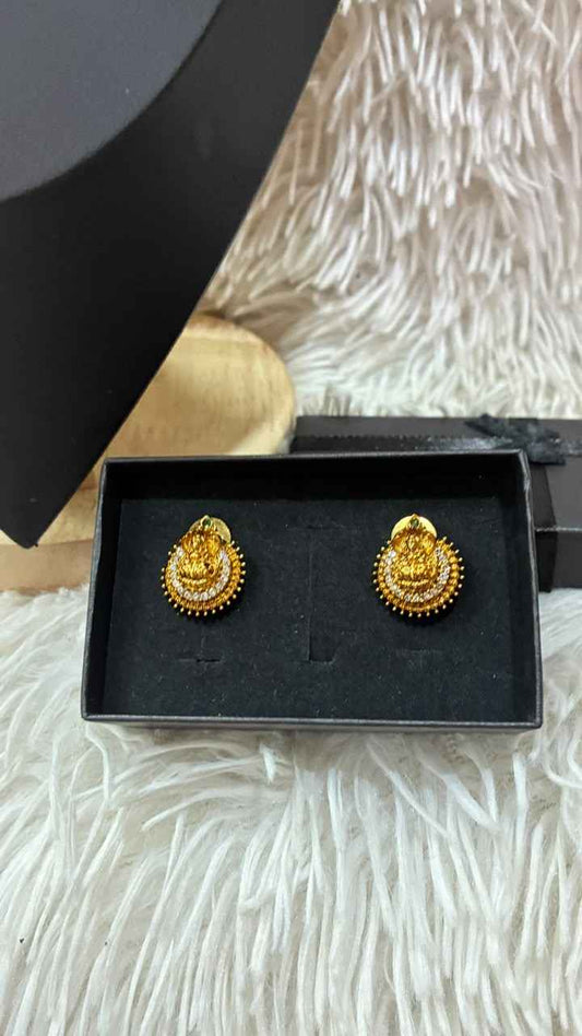 Lakshmi nanu necklace set features a traditional gold-plated design