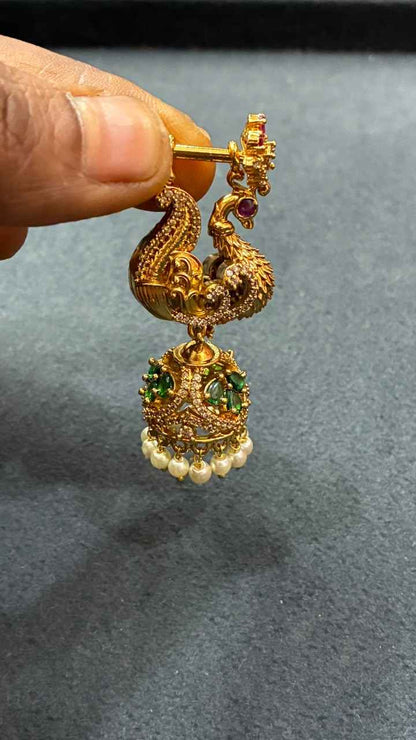 Makarakundanalu feature a detailed peacock design adorned with Pearls
