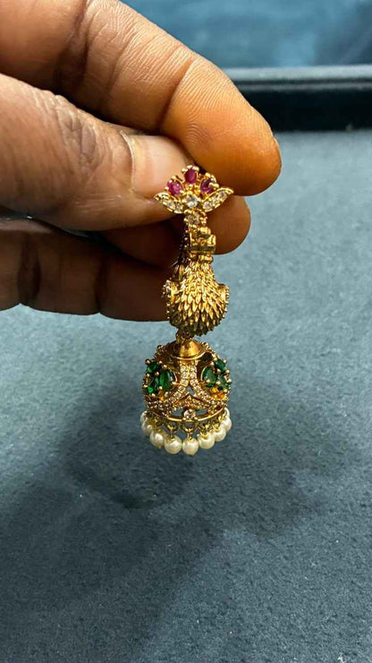 Makarakundanalu feature a detailed peacock design adorned with Pearls
