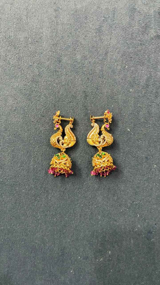 Makarakundanalu feature a detailed peacock design with Pink beads