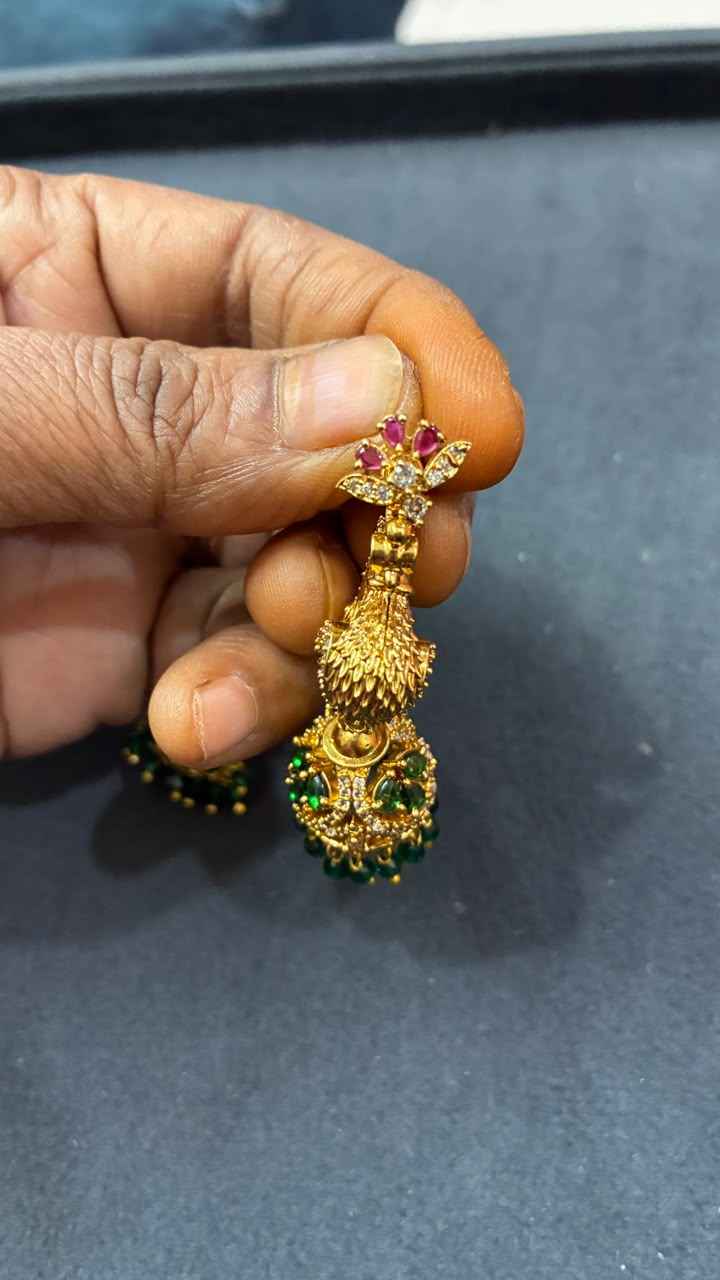 Makarakundanalu feature a detailed peacock design with Green Beads
