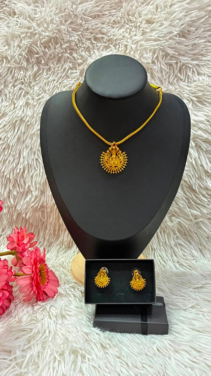 Lakshmi nanu necklace set features a traditional gold-plated design