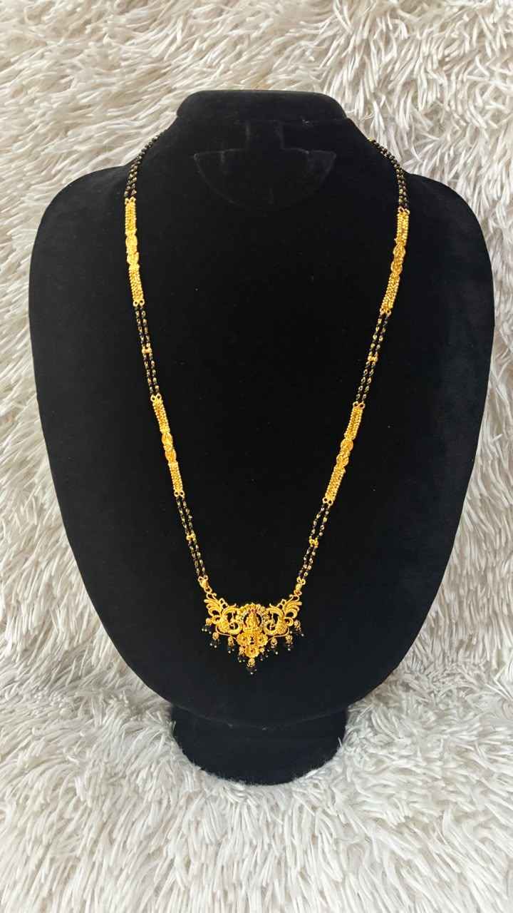 Traditional gold mangalsutra featuring a delicate floral lakshmi motif