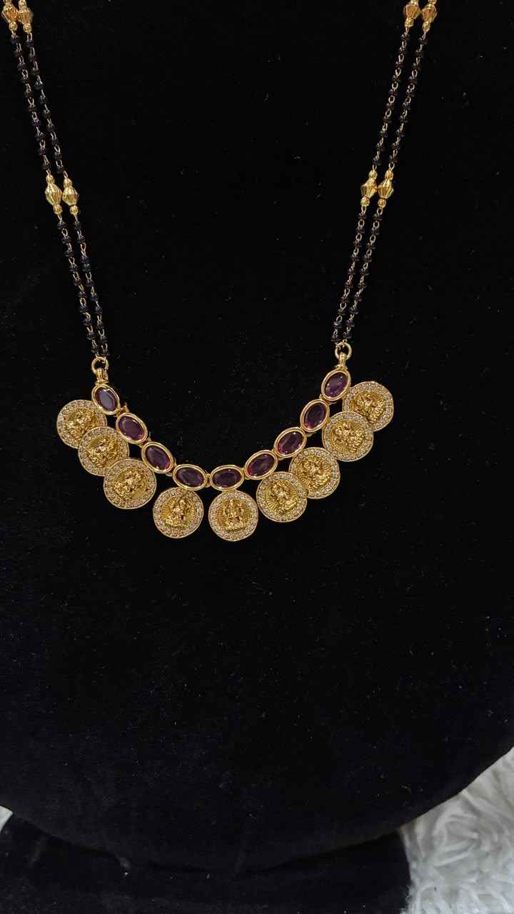 Traditional double-string black bead mangalsutra featuring a Lakshmi kasu pendant