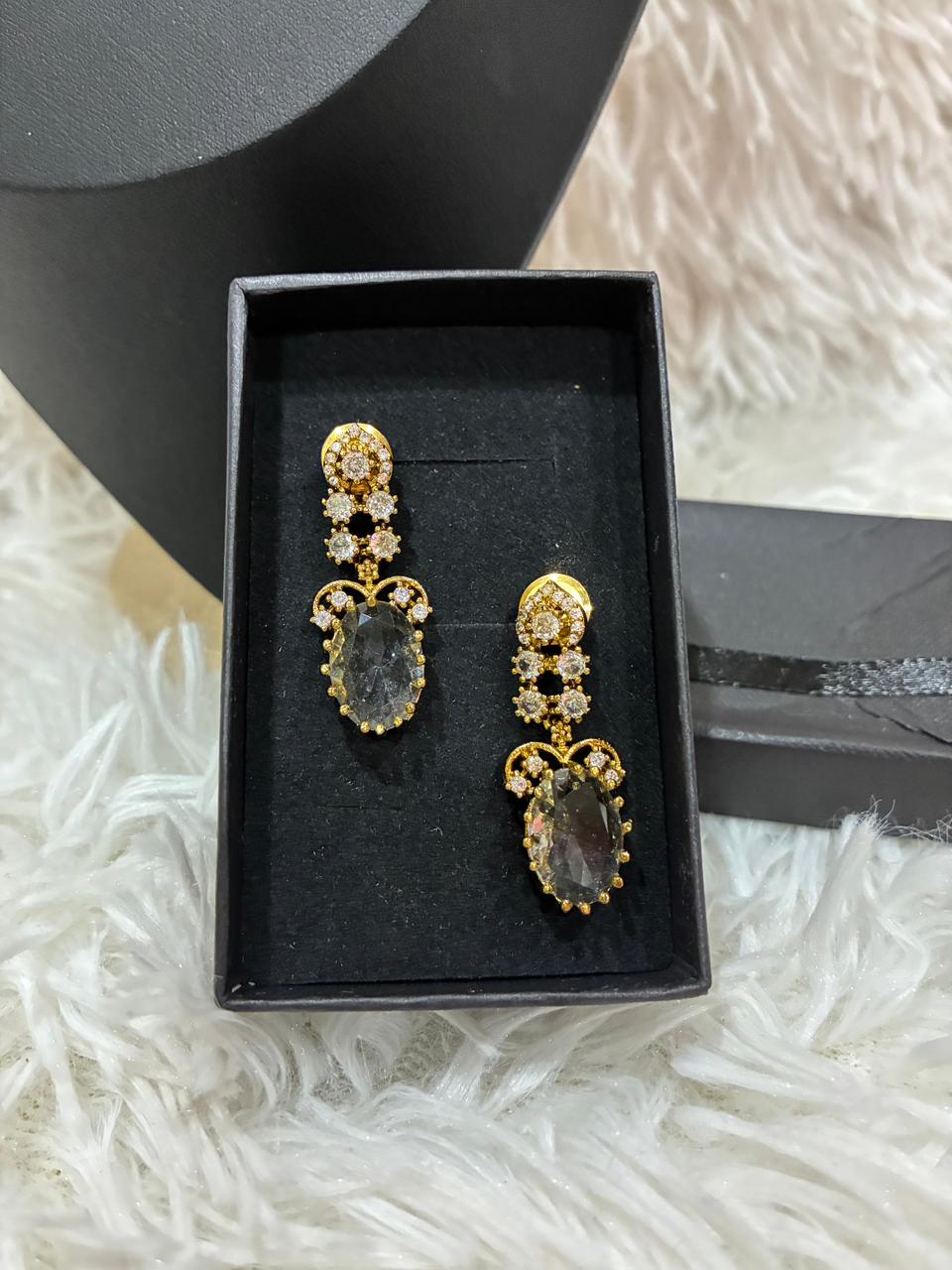 AD stoned necklace set in a gold tone