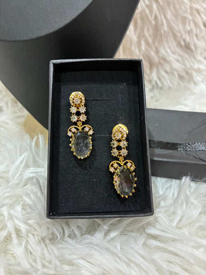 AD stoned necklace set in a gold tone