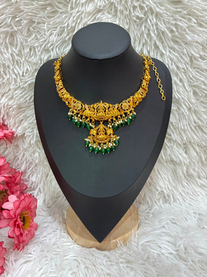 Temple jewelry necklace Lakshmi and peacock design adorned with green bead drops