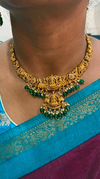 Temple jewelry necklace Lakshmi and peacock design adorned with green bead drops