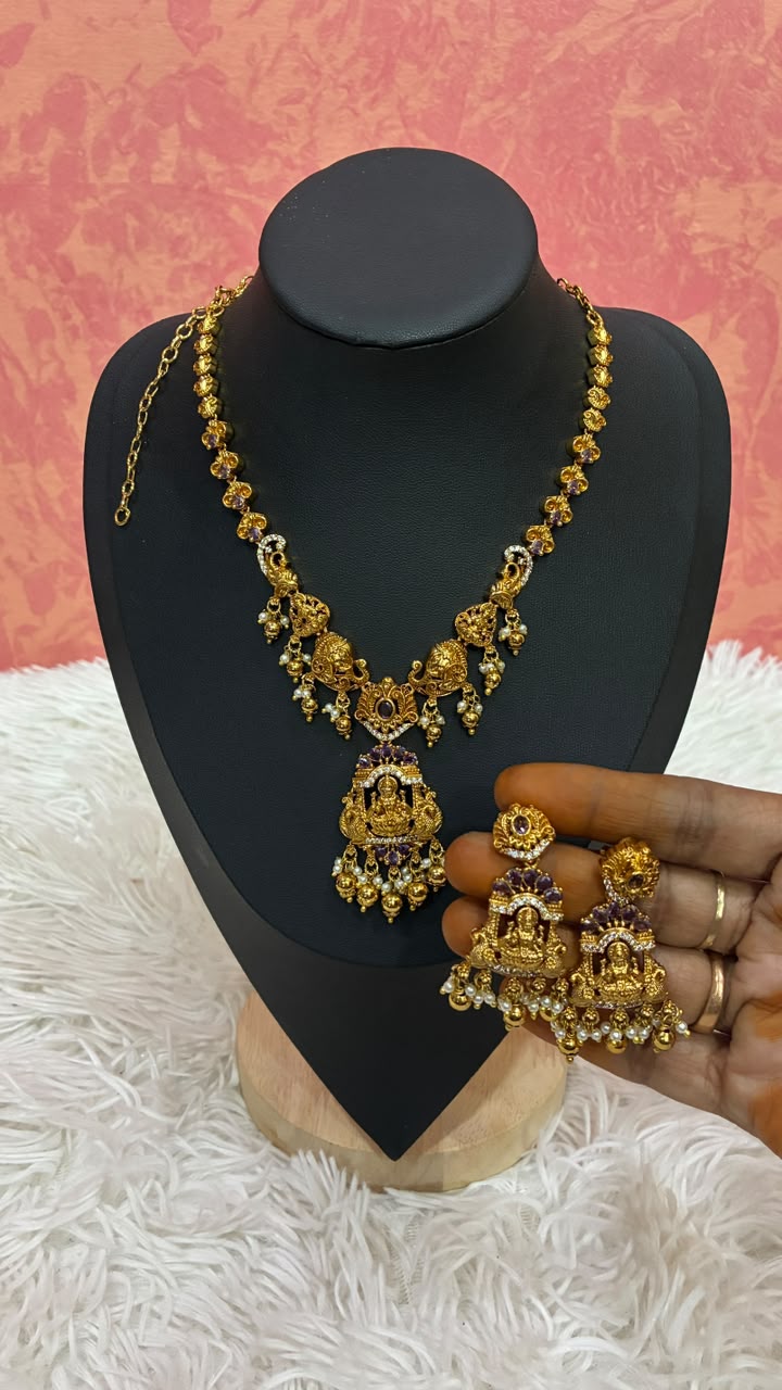Antique gold-plated temple jewelry set features intricate Lakshmi motifs