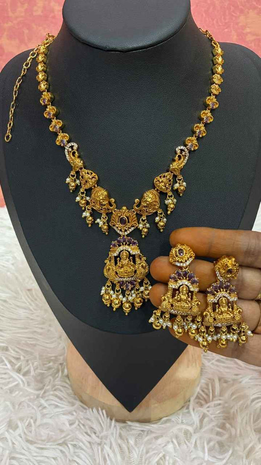 Antique gold-plated temple jewelry set features intricate Lakshmi motifs