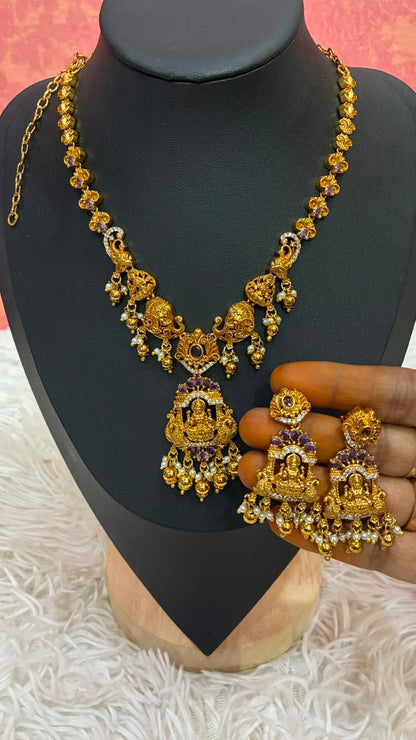 Antique gold-plated temple jewelry set features intricate Lakshmi motifs
