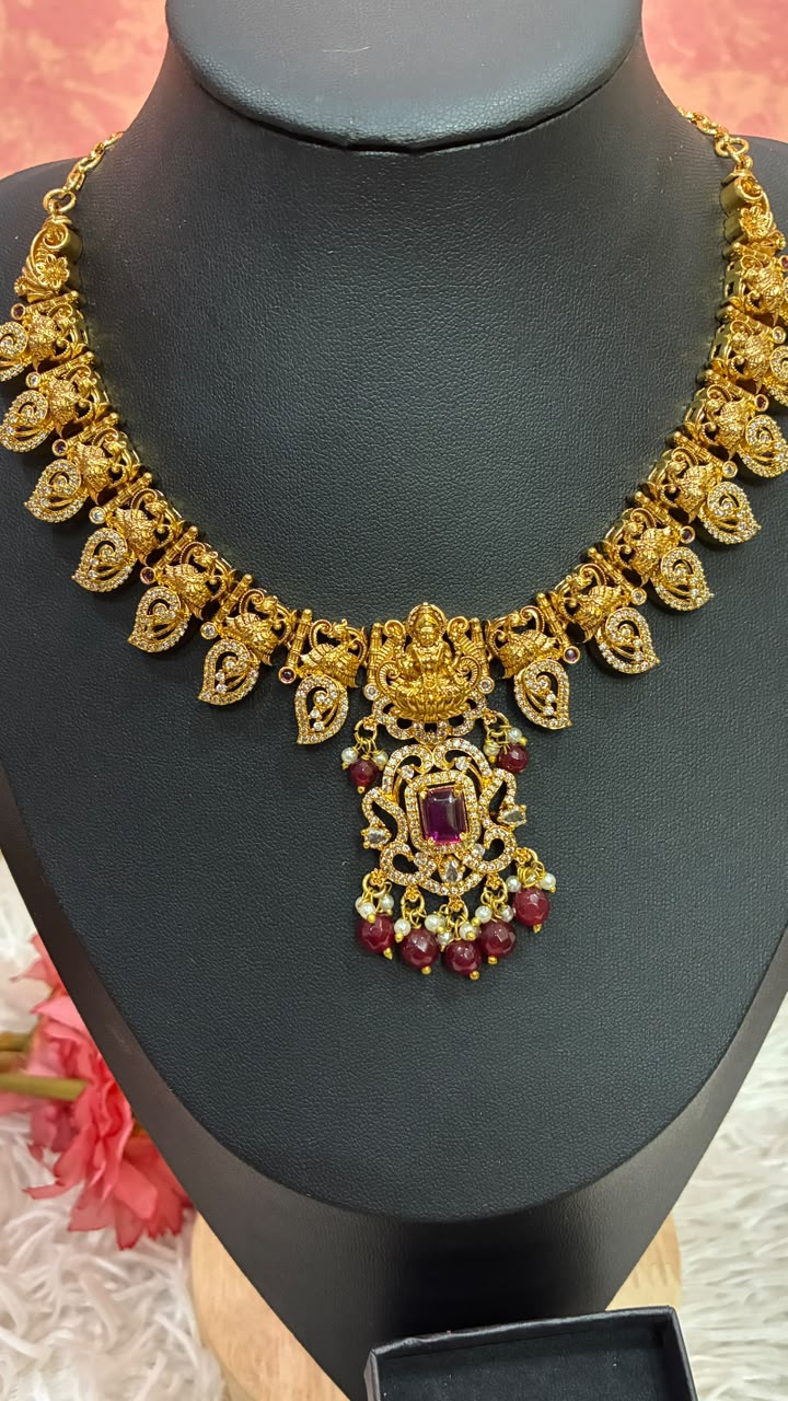 Gold-plated temple style Lakshmi motif necklace set with Mango shaped design