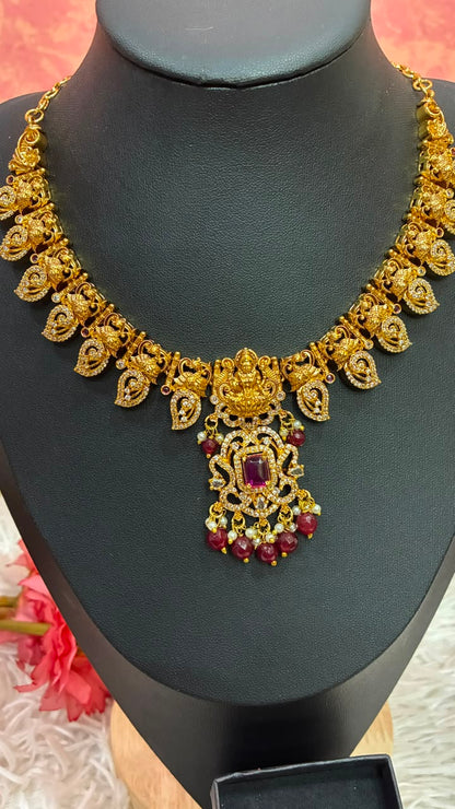 Gold-plated temple style Lakshmi motif necklace set with Mango shaped design